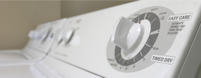 Control knobs on a white dryer and a white and light blue clip art dryer with purple pants tumbling inside